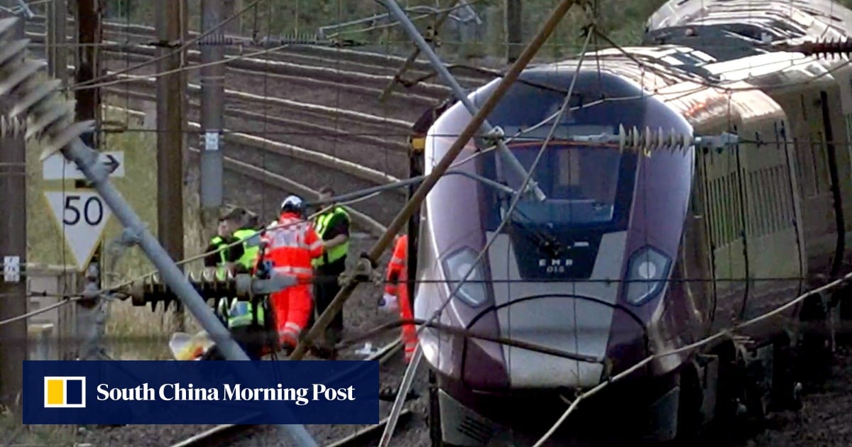 2 trains collide north of London, killing 1 and injuring dozens