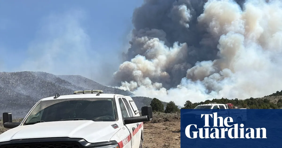 Utah wildfire forces evacuation of small town as extreme heat roasts US west