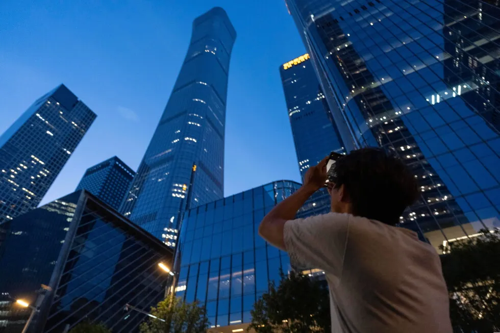 Tallest building in Beijing is damaged after small airplane reportedly crashed into it