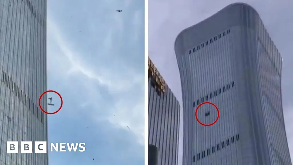 Debris falls after plane hits Beijing's tallest building