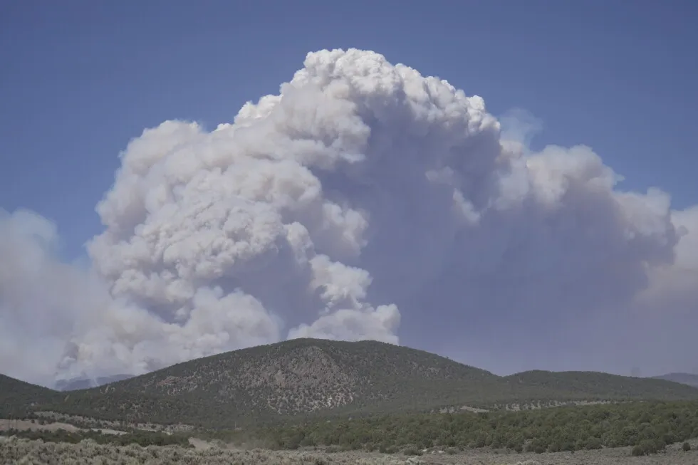 Dangerous weather hampers firefighters and leads to fireworks bans in western US