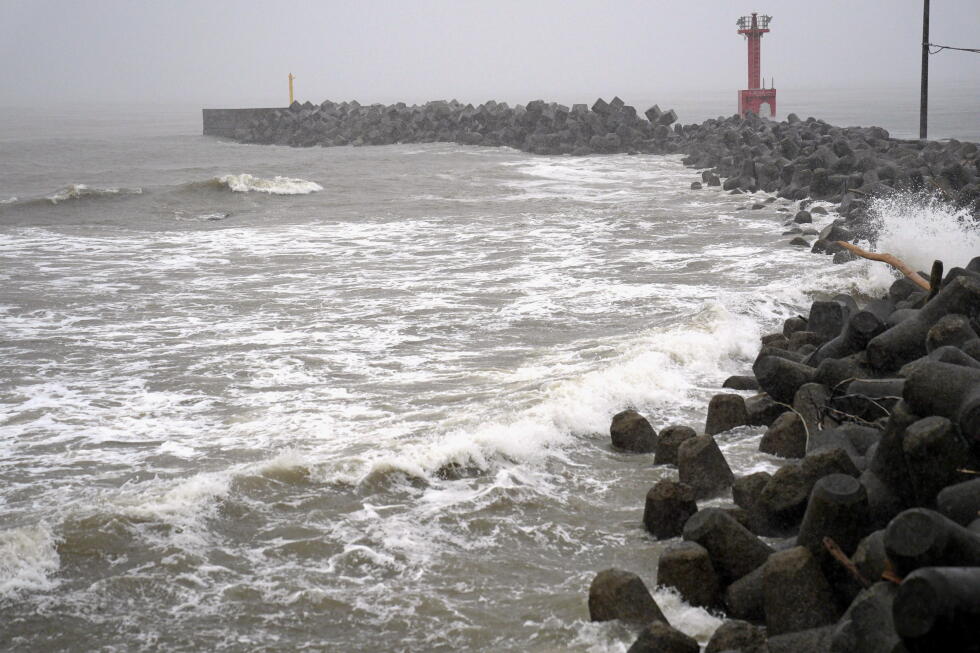 Heavy rain pounds western Japan as 2 tropical storms approach