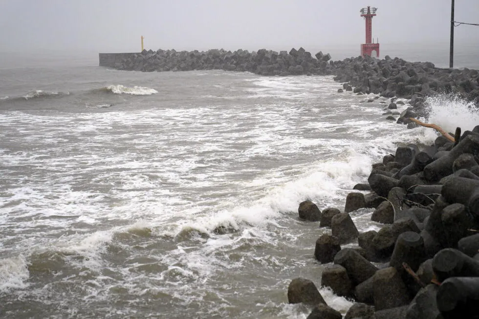 Heavy rain pounds western Japan as 2 tropical storms approach