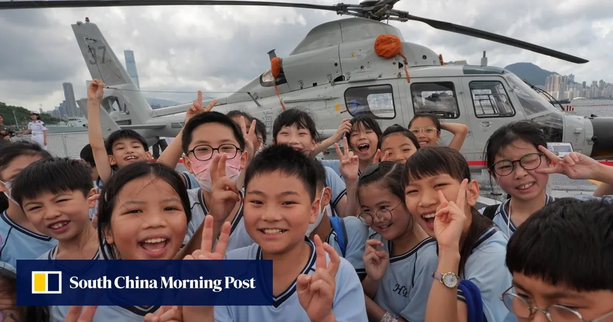 Hong Kong students tour PLA Navy warships for lesson on national defence