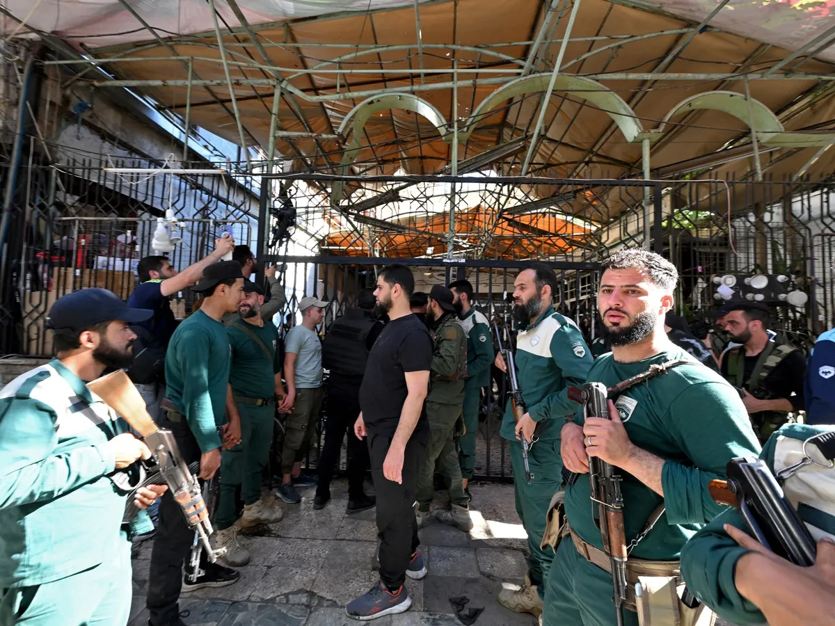 Mourners bury victims of Damascus cafe bombing with six lawyers among dead