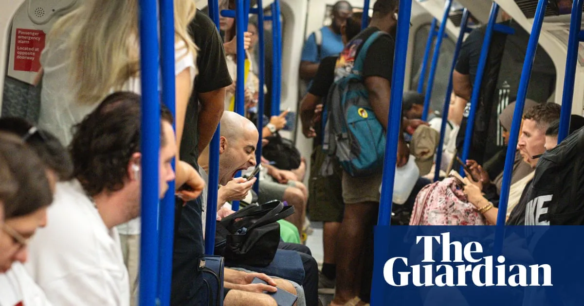 ‘Like a sauna’: London tube travellers swelter in temperatures higher than legal limit for cattle