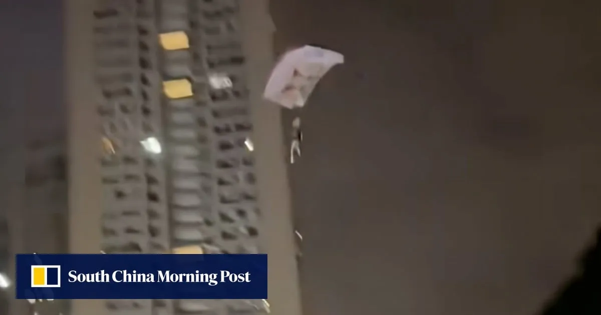Man charged for disturbing public order in China after parachuting off residential building