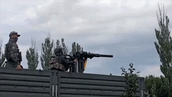 WATCH: Russian soldier thrown through air as Soviet-era helicopter gun spins out of control