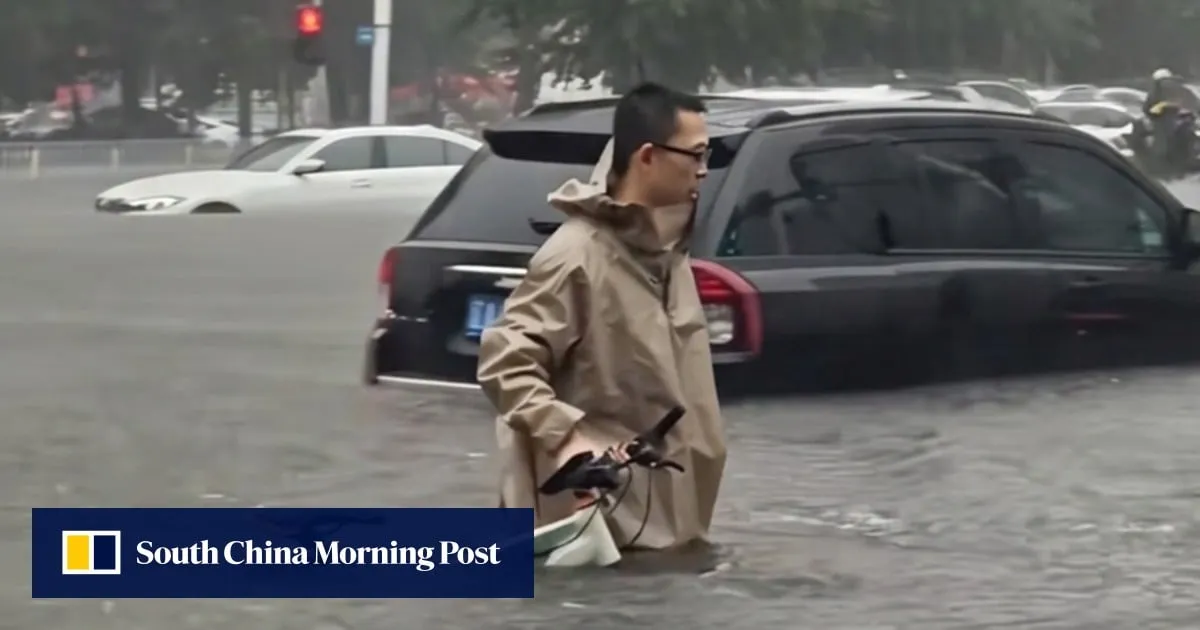 Chinese doctor wades through severe floodwaters to reach patients, winning widespread praise