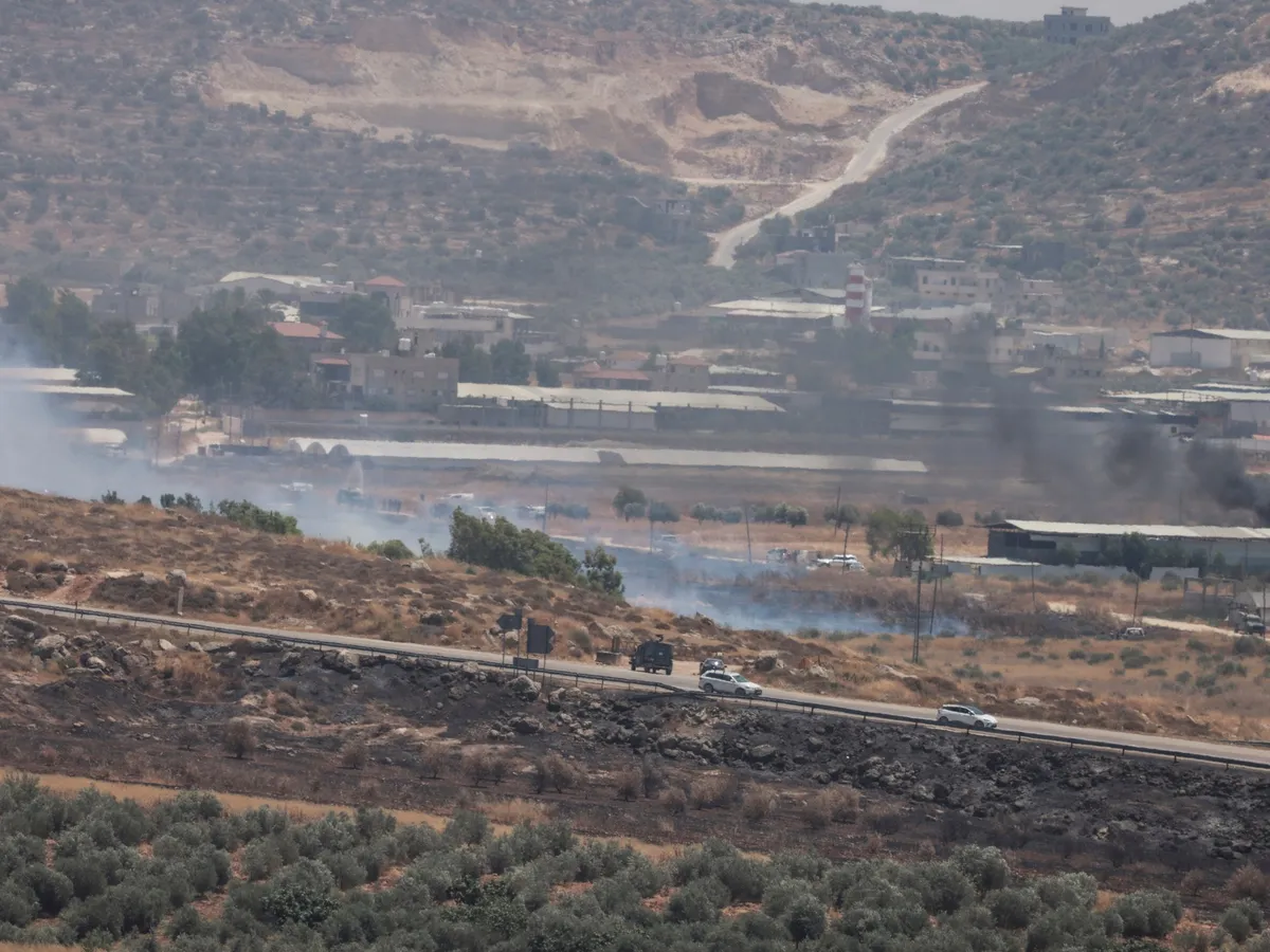 Two Palestinians shot dead by Israeli forces as West Bank fields set ablaze