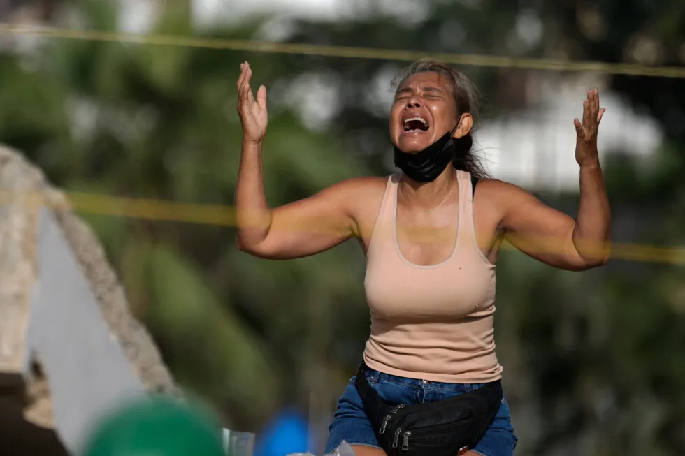 One frame captures a mother’s anguish during a search through a collapsed building in Venezuela