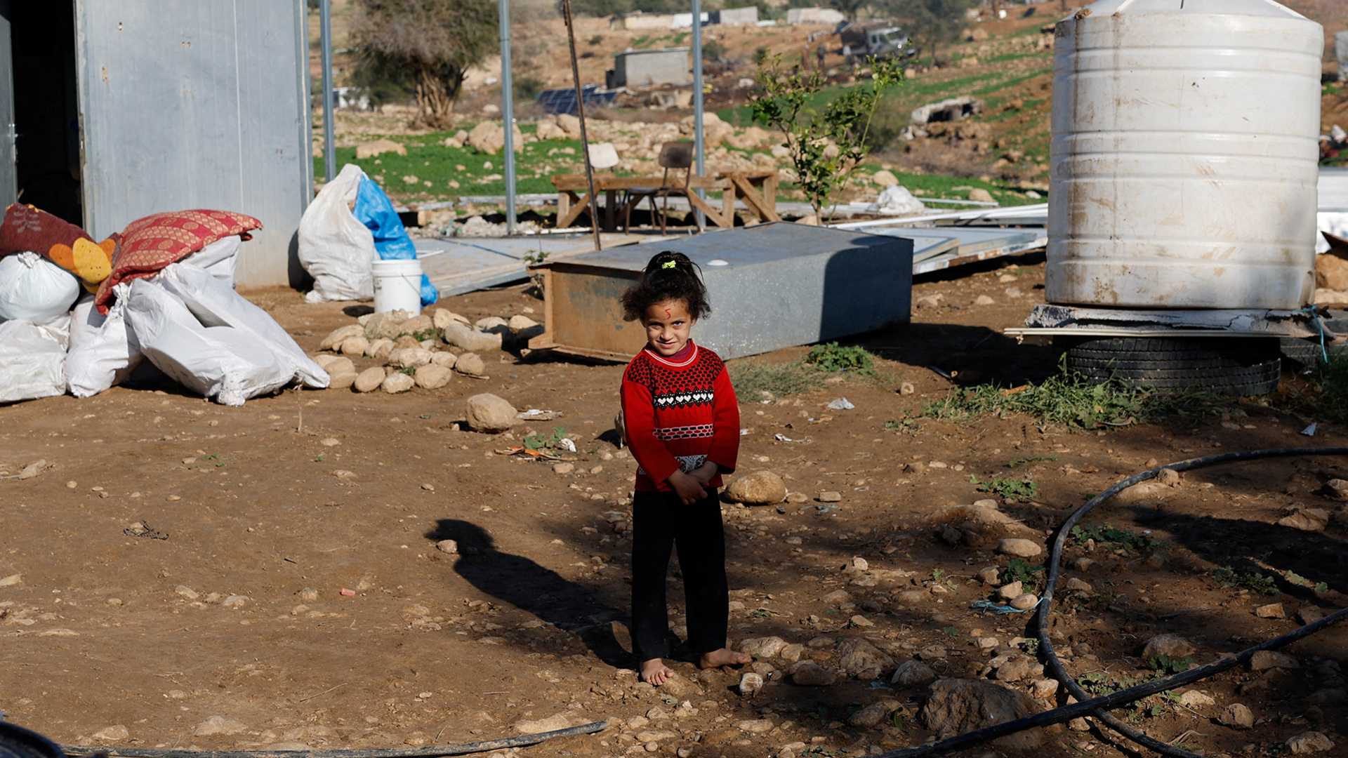 Israeli settlers forcibly displacing largest Palestinian Bedouin village