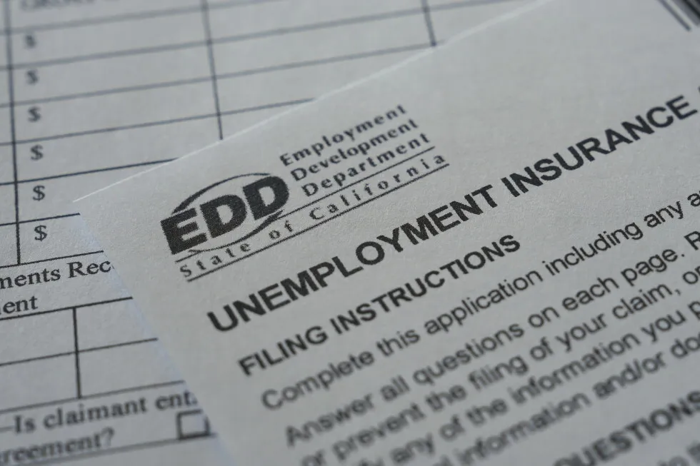 US filings for jobless benefits rise to 197,000 last week, but layoffs remain historically low