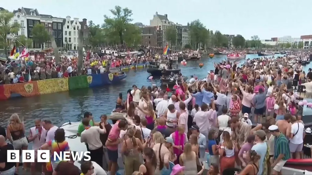 Crowds line Amsterdam's canals for Pride boat parade
