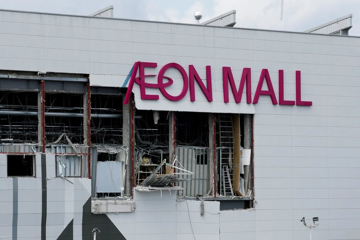 Two workers who died in quake-hit Japan mall were sent in to get cash