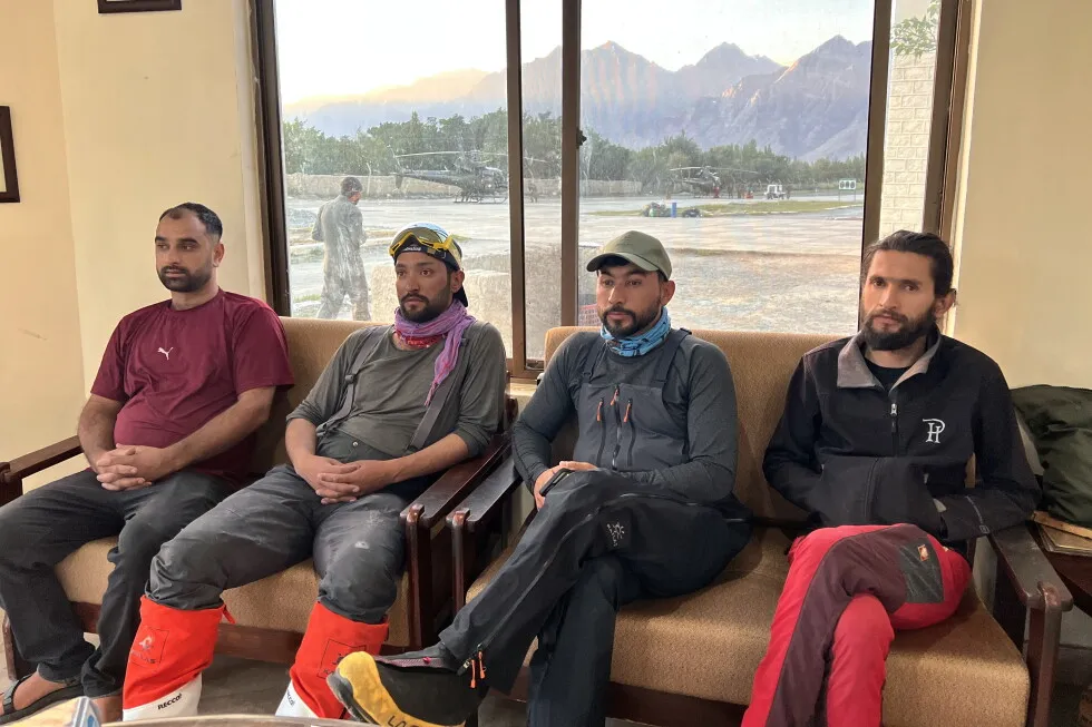 Pakistan teams search on foot for remains of climbers as weather grounds helicopters