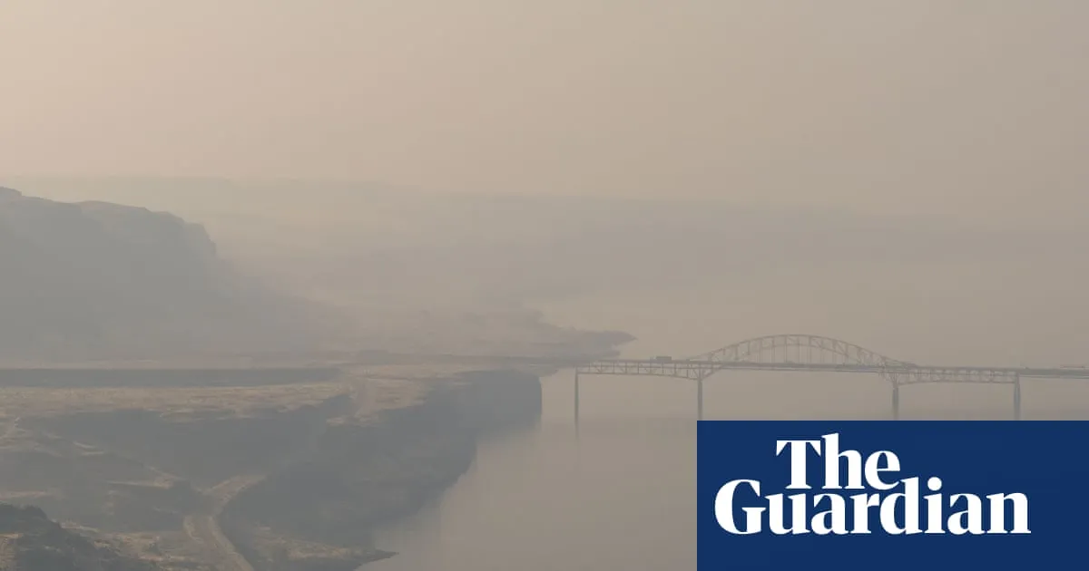 US Pacific north-west blanketed in thick smoke as firefighters push back blazes